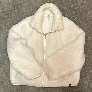 Varley brand white fleece jacket - Peloton limited edition.